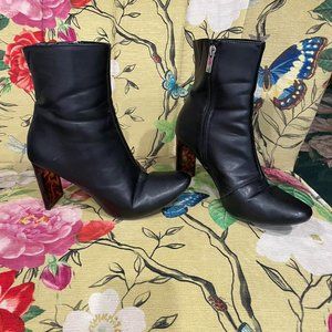 Black ankle boot with glassy brown cheetah print heel and zip closure